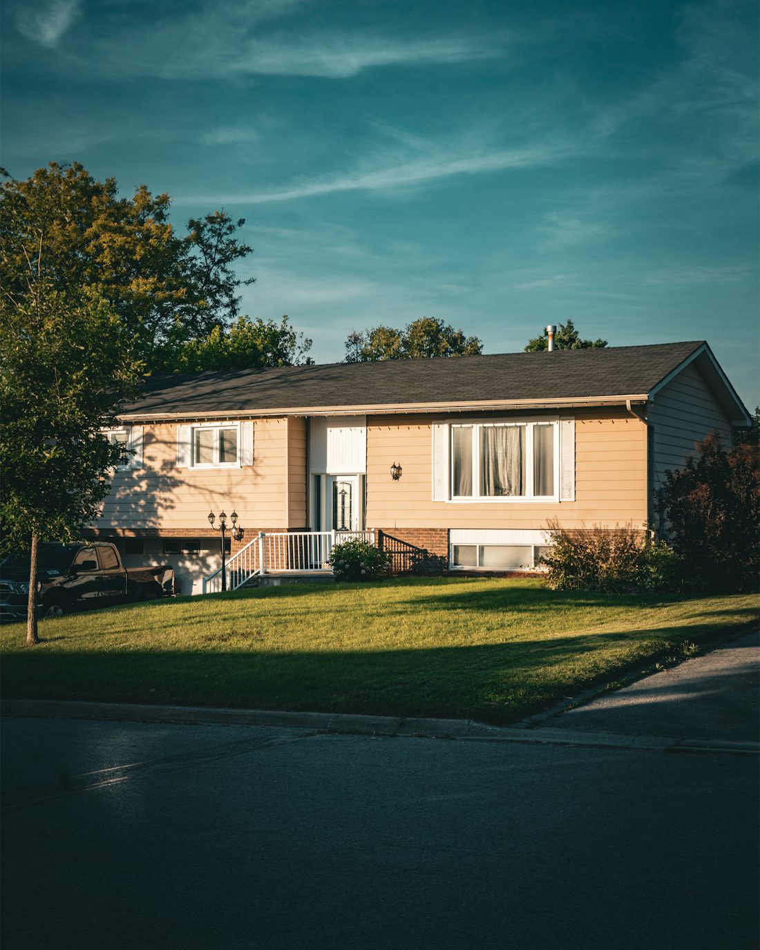 A single-family home on a Houston street at the end of the day